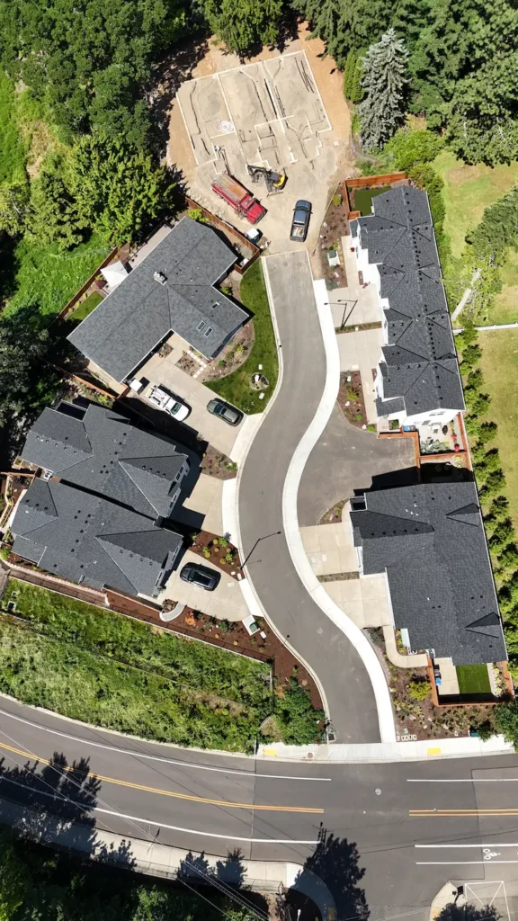 A row of houses in a neighborhood that had full roof replacements installed.